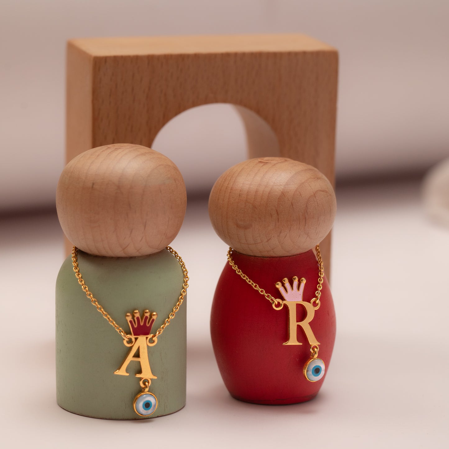 INITIAL WITH CROWN AND EVIL EYE HANGING NECKLACE