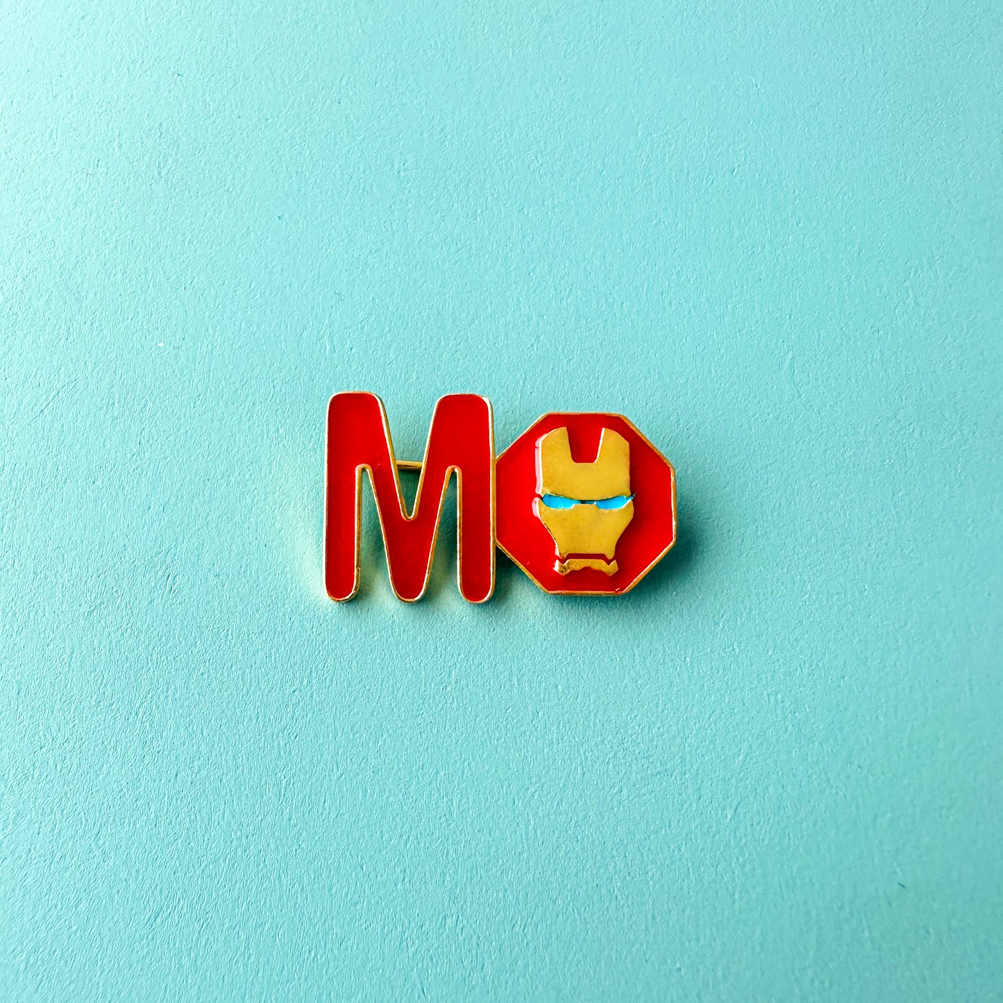 "M" WITH SUPERHERO M NAME PIN