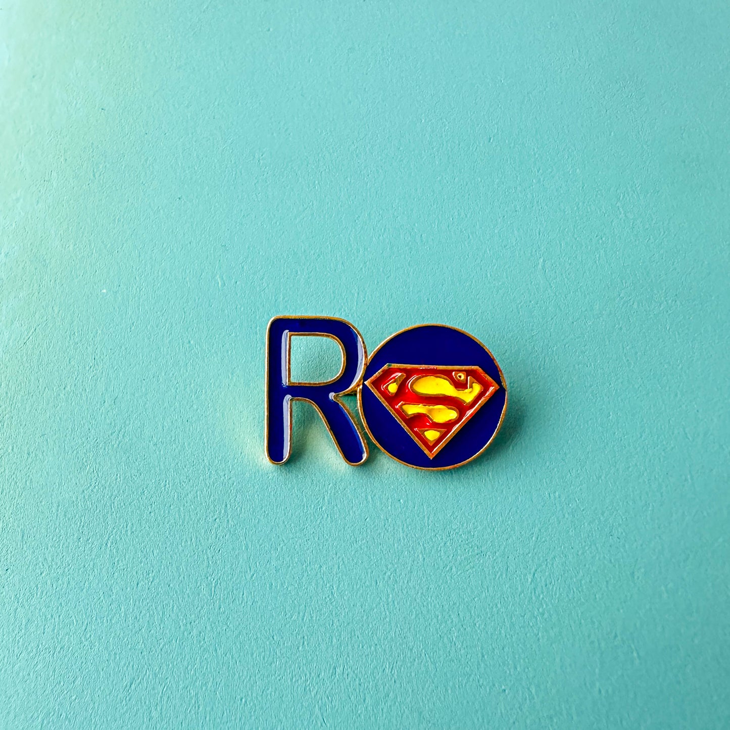 "R" WITH SUPERHERO S NAME PIN