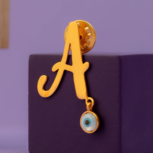 A WITH EVIL EYE HANGING BROOCH WITH GOLD POLISH