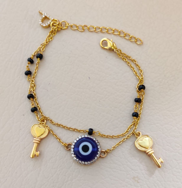 "KEYS WITH EVIL EYE" IN GOLD POLISH