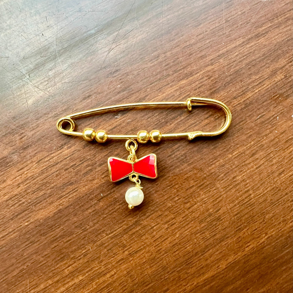 RED BOW LAPEL PIN