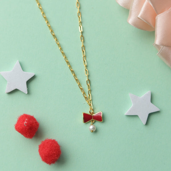 RED BOW WITH PEARL NECKLACE